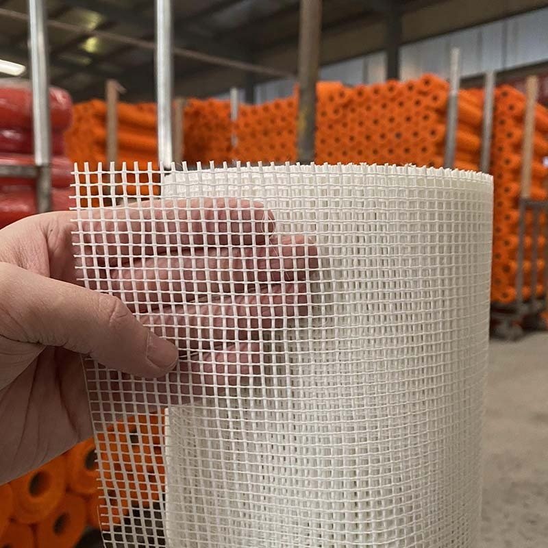 Fiberglass mesh hand detail showing aperture and yarn structure