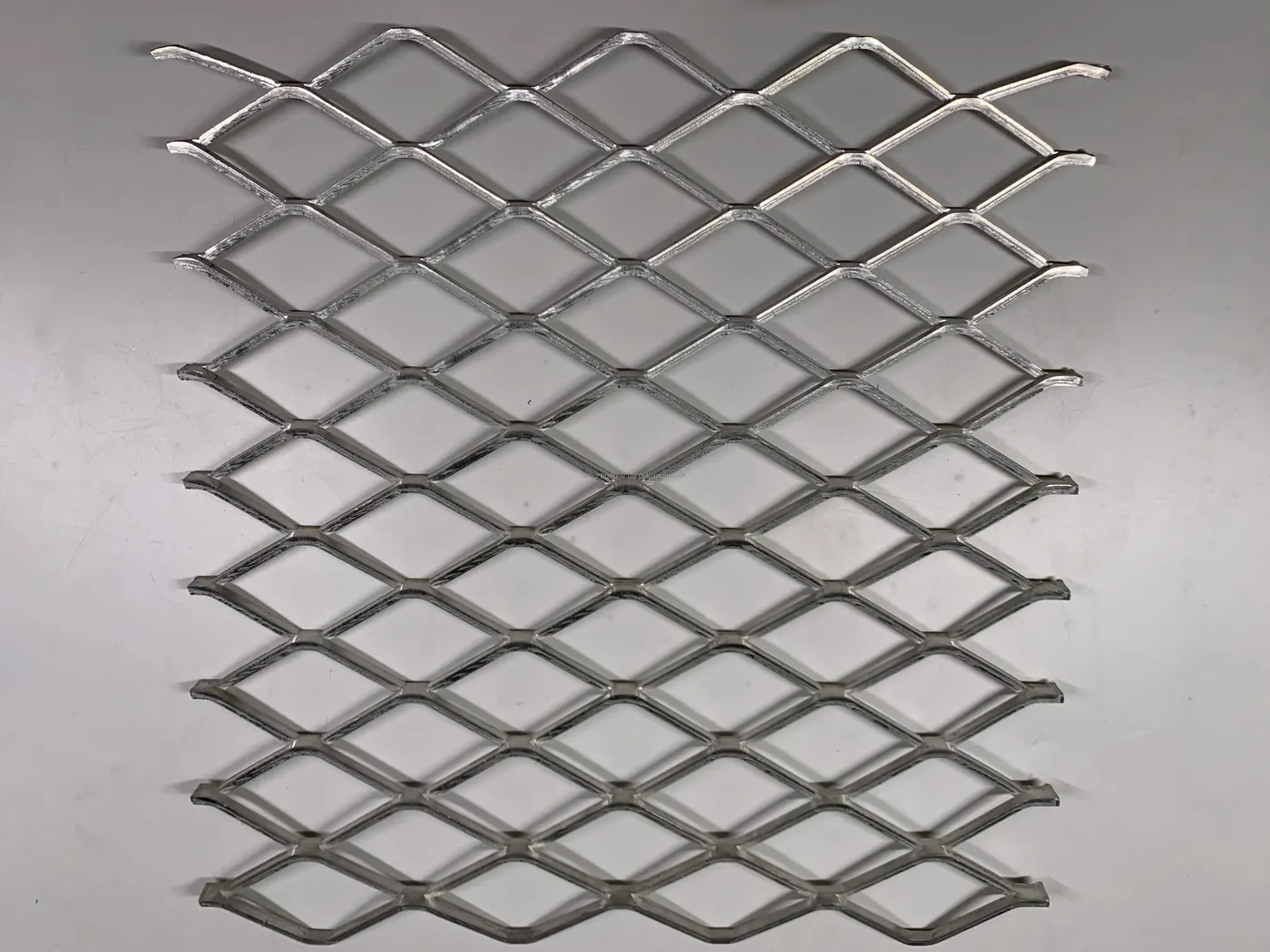 Large opening expanded metal detail showing opening direction and strand