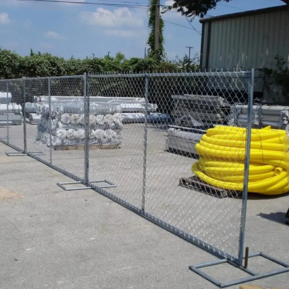 Temporary fence panels arranged with portable feet for site control